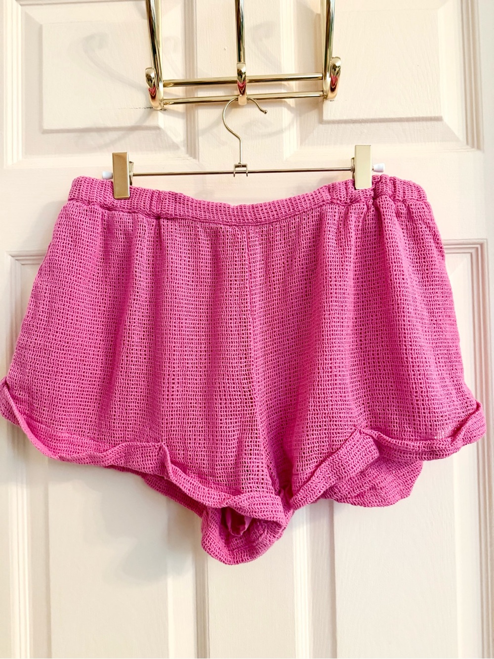 Pink netted out from under shorts